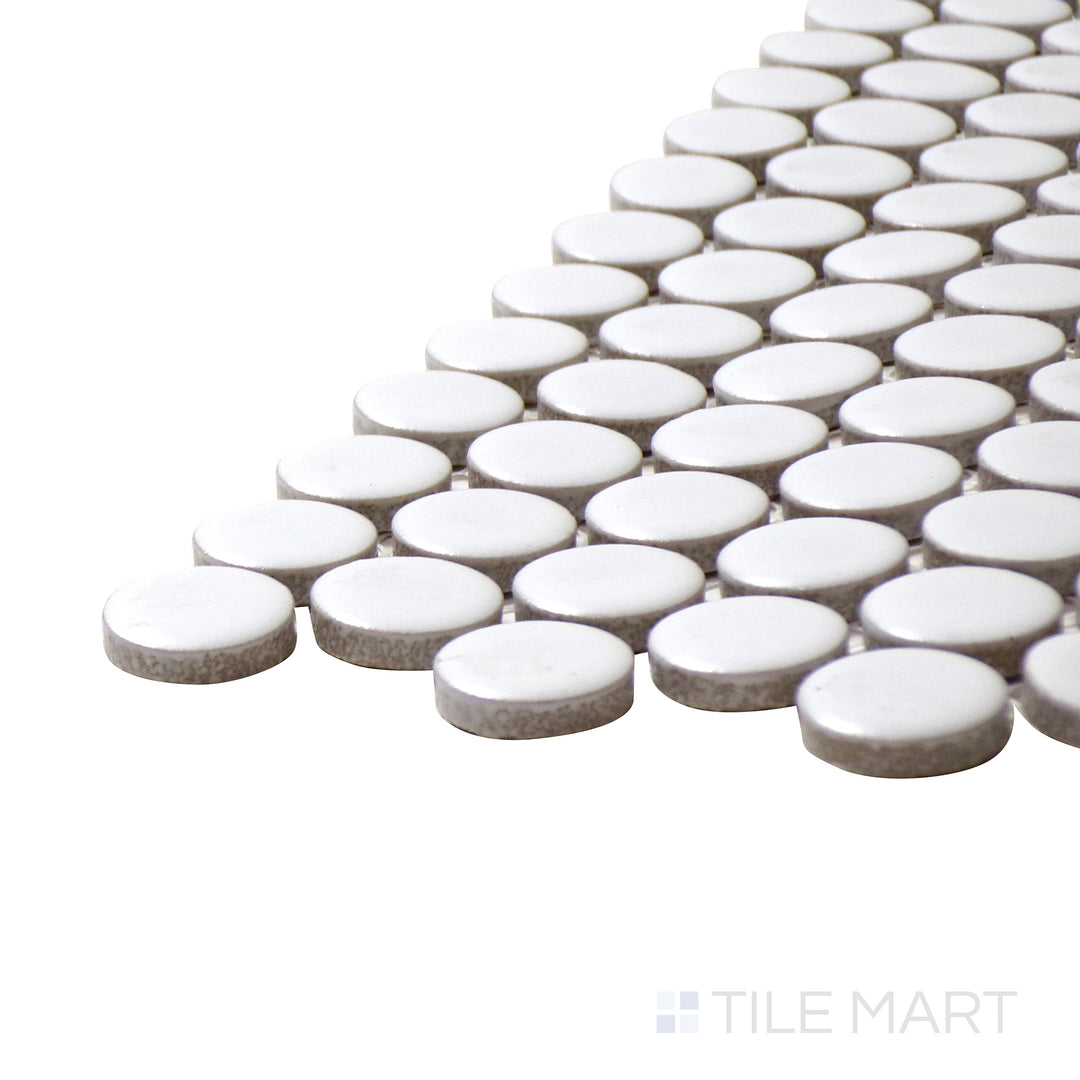 A corner perspective of the Pure White Penny Round Matte Porcelain Mosaic emphasizes its bright white tone and understated matte finish, ideal for timeless elegance.