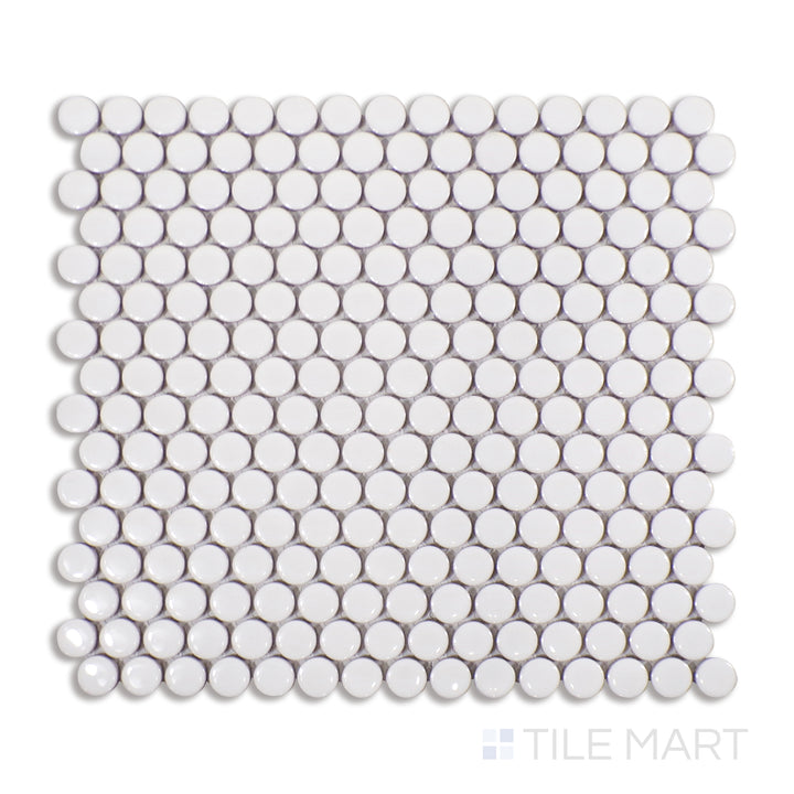 Top-down view of matte white penny round porcelain mosaic tiles, providing a smooth, structured design that complements both classic and modern interiors.