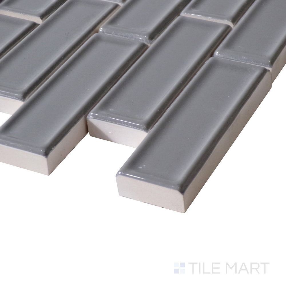 Angled shot highlights the deep metallic tones and reflective shine of Roxy Hematite Brick Glossy Porcelain Mosaic, enhancing modern interiors.