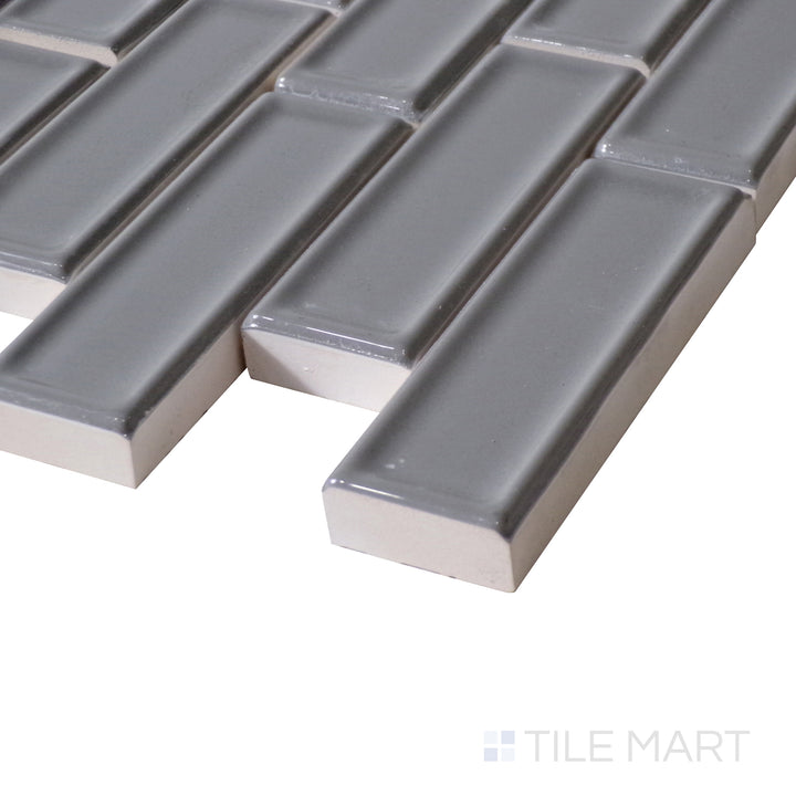 Angled shot highlights the deep metallic tones and reflective shine of Roxy Hematite Brick Glossy Porcelain Mosaic, enhancing modern interiors.