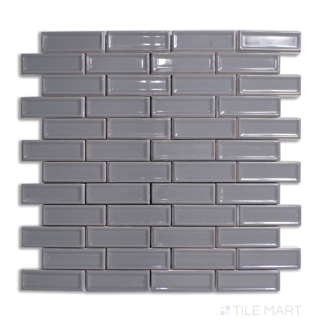 Top-down view of Roxy Hematite brick glossy porcelain mosaic, featuring a deep metallic sheen that enhances industrial and modern interiors.