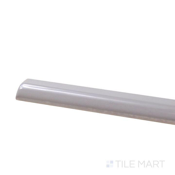 A corner shot of the Roxy Moonstone 0.5X9 Glossy Porcelain Pencil presents a luminous moonstone color with a glossy surface, enhancing design accents with sophistication.