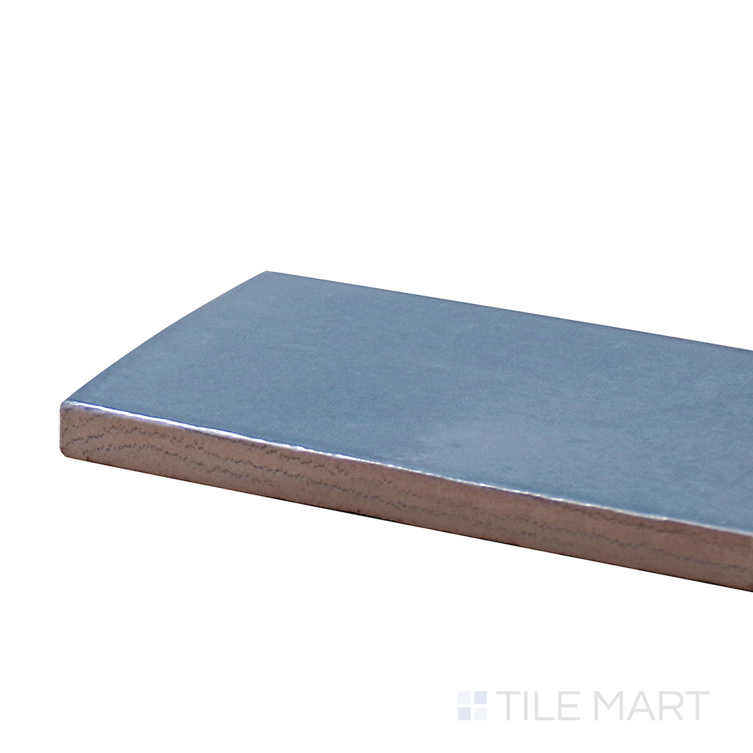 A corner shot of the Safi Aqua 2X6 Glossy Ceramic tile showcases its vibrant aqua hue with a sleek, glossy finish, perfect for fresh and modern interiors.