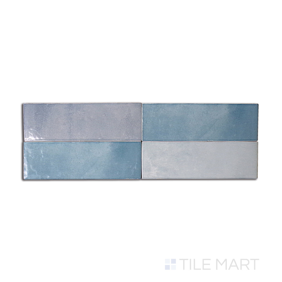 Top-down view of Safi Aqua 2x6 glossy ceramic tile, featuring a vibrant turquoise hue with a sleek, polished surface.