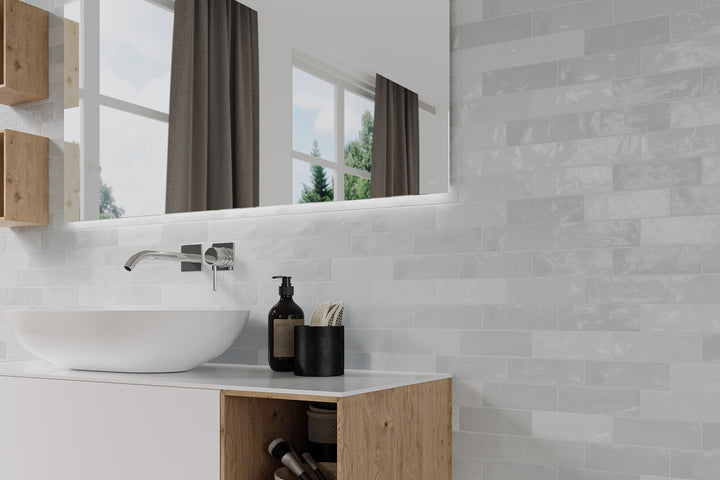 A chic and modern design featuring Safi Grey 2X6 Glossy Ceramic, offering a neutral yet striking appearance with a sleek finish.