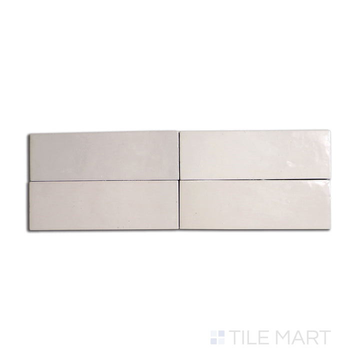 Overhead shot of Safi Nude 2x6 glossy ceramic tile, showcasing a warm, earthy beige tone with a lustrous sheen.