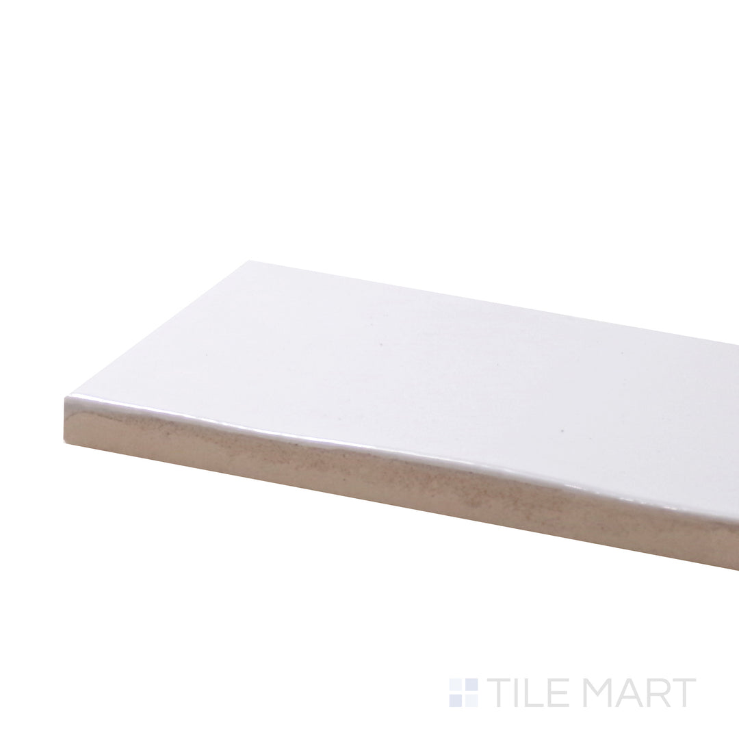 A corner shot of the Safi White 2X6 Glossy Ceramic tile emphasizes its crisp white color and polished glossy surface, ideal for a clean and contemporary look.