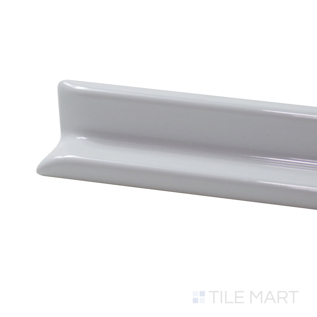 Captured from a corner angle, the Sanitary Cove Base Black 6X6 Glossy Porcelain tile showcases a deep black hue with a high-gloss finish, perfect for bold, modern settings.