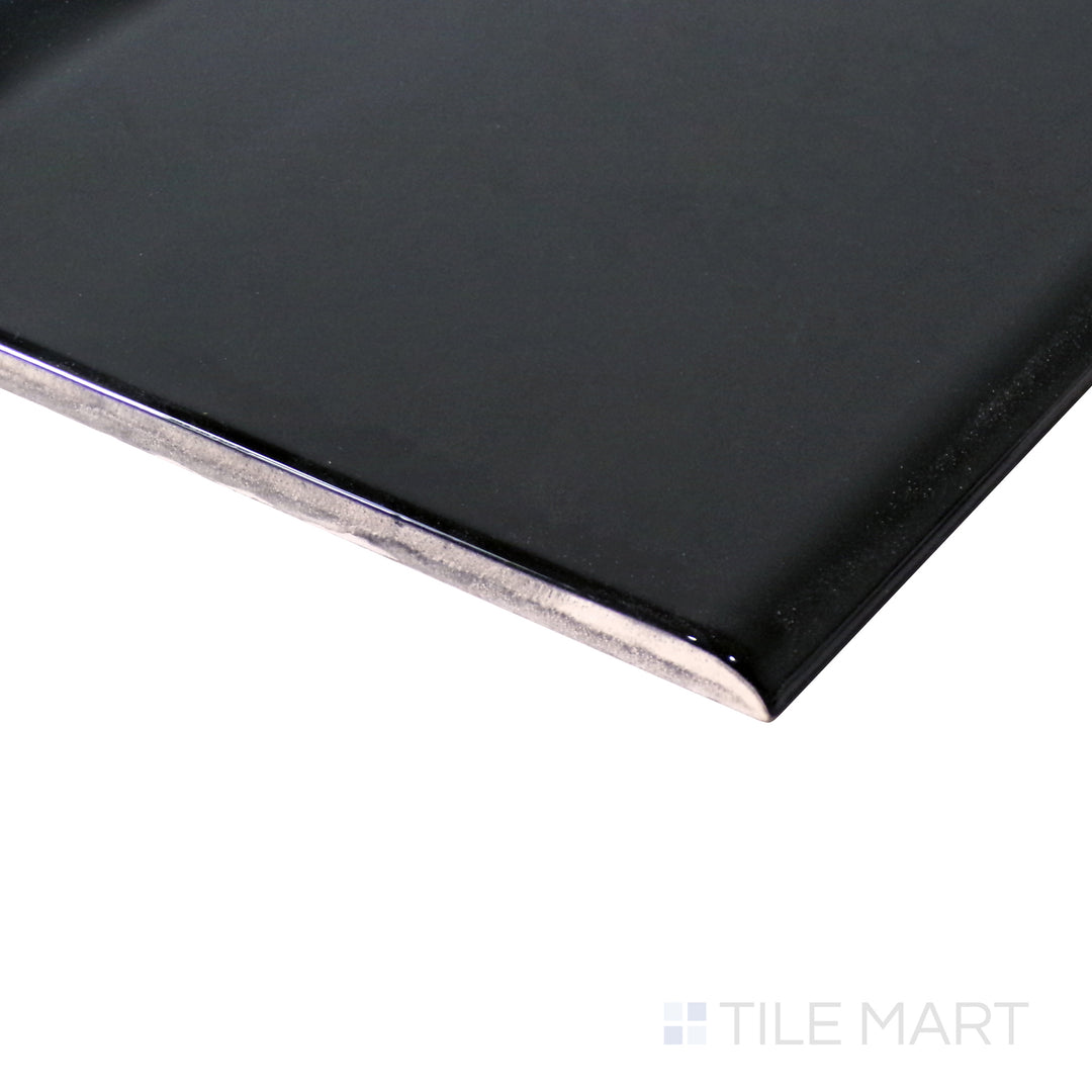 Angled shot emphasizes the bold, deep finish of Sanitary Cove Base Black 6X6 Glossy Porcelain, a sleek accent for modern tiled spaces.