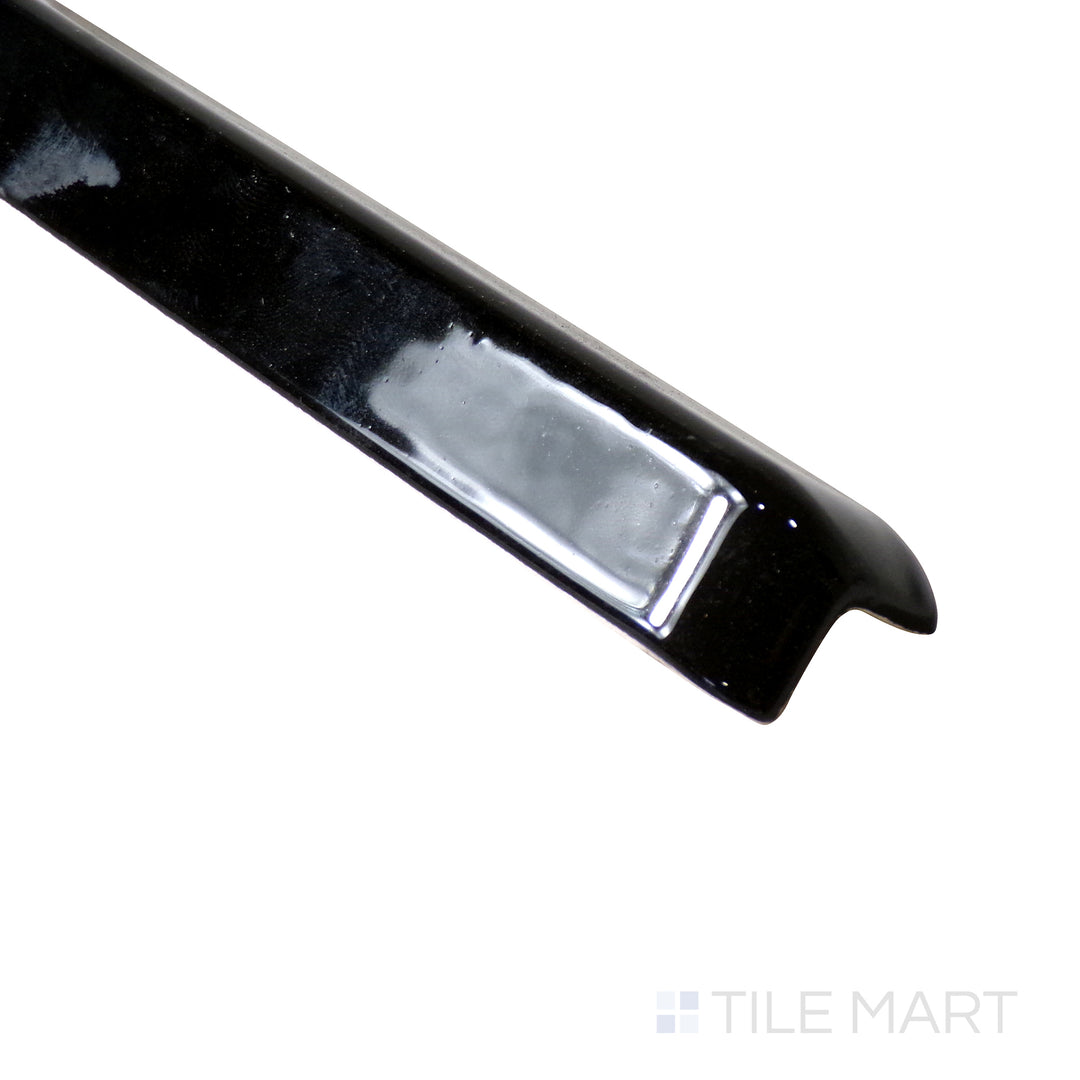 Close-up perspective captures the sleek, curved design of Sanitary Cove Base Black 1X6 Glossy Porcelain Outside Corner, ensuring a sophisticated, durable edge.