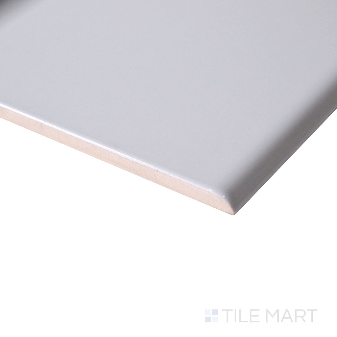 Angled shot enhances the soft, neutral tone of Sanitary Cove Base Gray 6X6 Glossy Porcelain, offering a balanced, modern aesthetic.