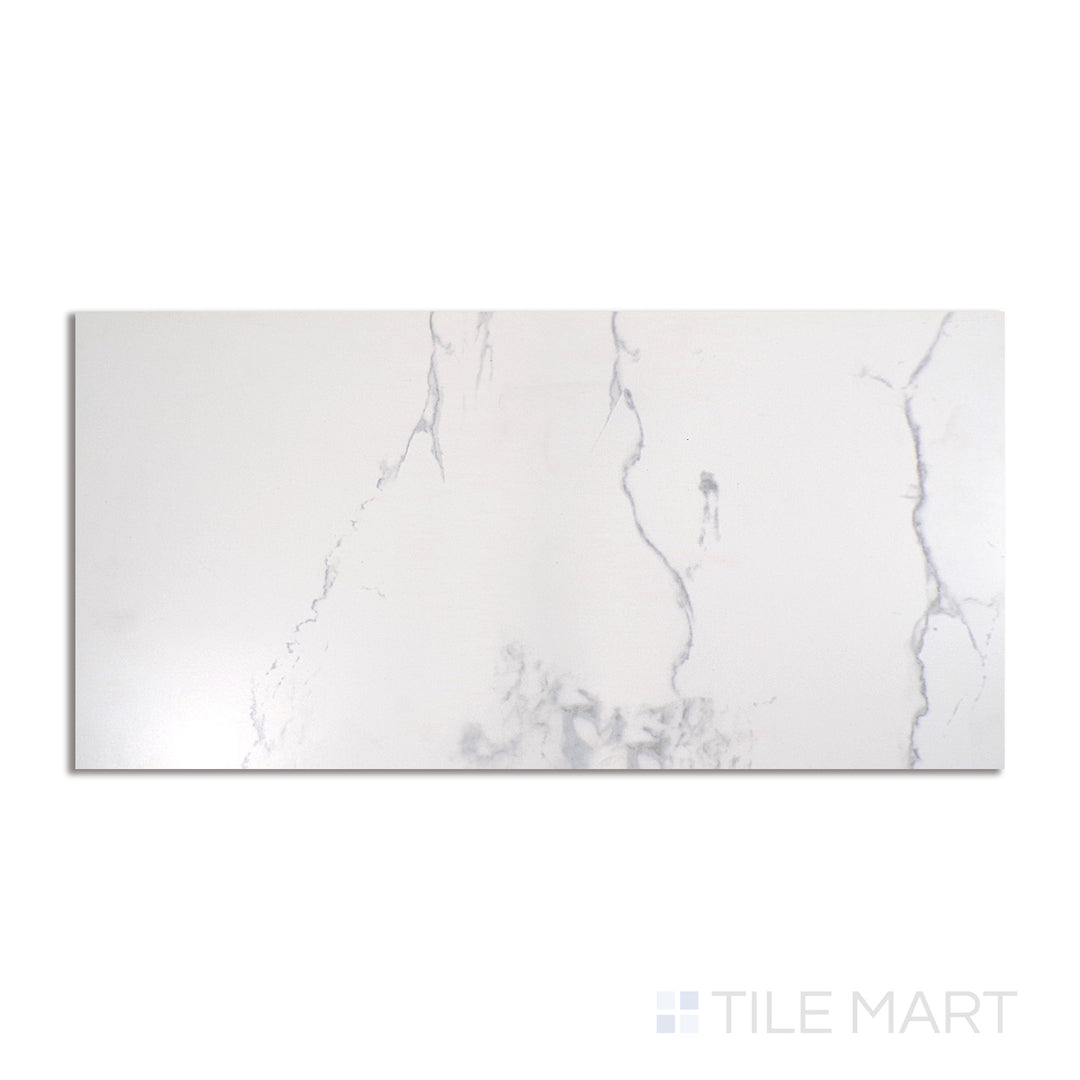 Top-down view of Select White Carrara White 12x24 matte porcelain tile, featuring a soft white base with subtle gray veining.