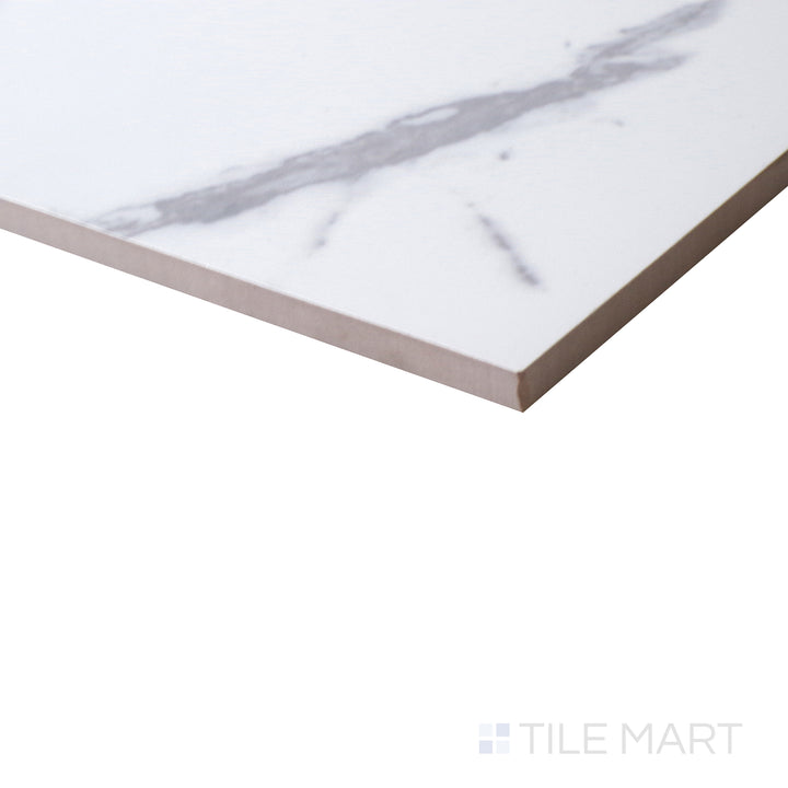 Glossy surface reflects light beautifully in this angled shot of Select White Carrara White 12X24 Polished Porcelain, adding luxury to any space.