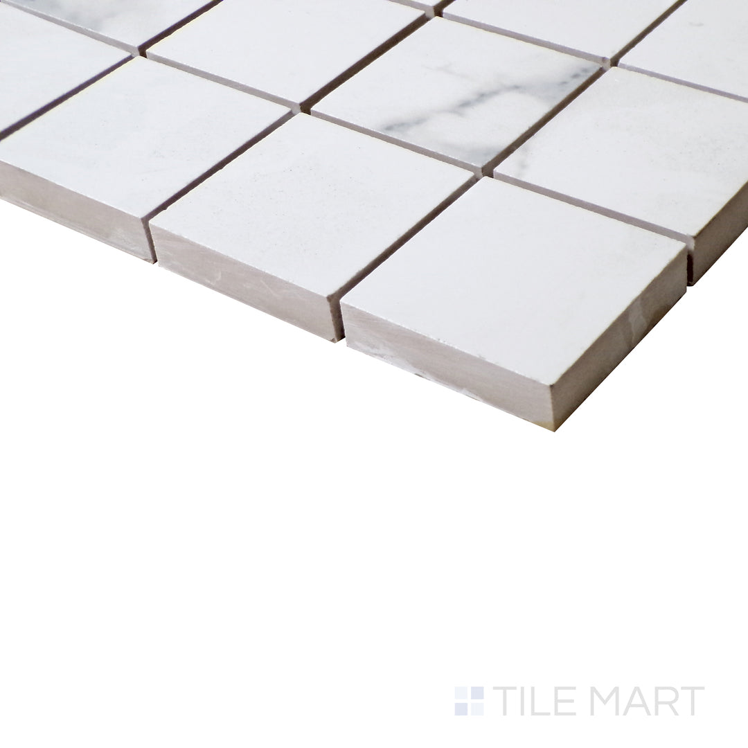 Side shot emphasizes the glossy sheen of Select White Carrara White 2" Square Polished Porcelain Mosaic, perfect for accent walls and luxe finishes.