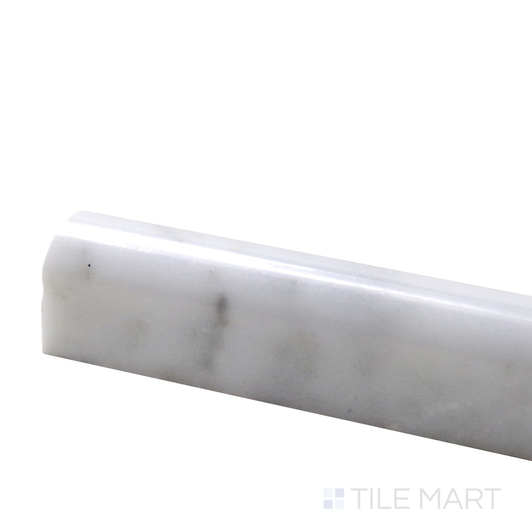 Angled view of Sto-Re Carrara 0.75X12 Polished Marble Pencil, showcasing its soft white base with delicate gray veining and a glossy finish.