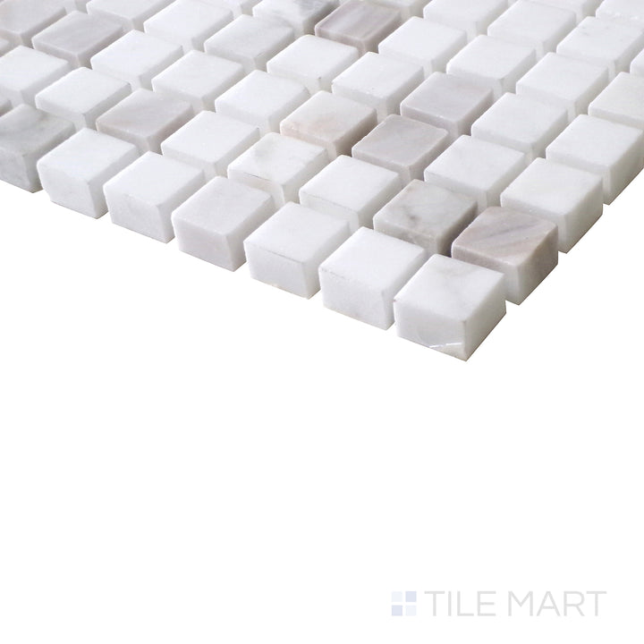 Angled perspective of Sto-Re Volakas 5/8" mini square polished marble mosaic, emphasizing its elegant white base, soft gray veining, and symmetrical square layout.  