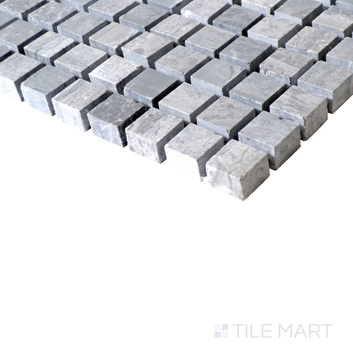 Slanted shot of Sto-Re Wooden Blue 5/8" mini square polished marble mosaic, capturing its distinctive wooden-blue hues, smooth polish, and structured square arrangement.  