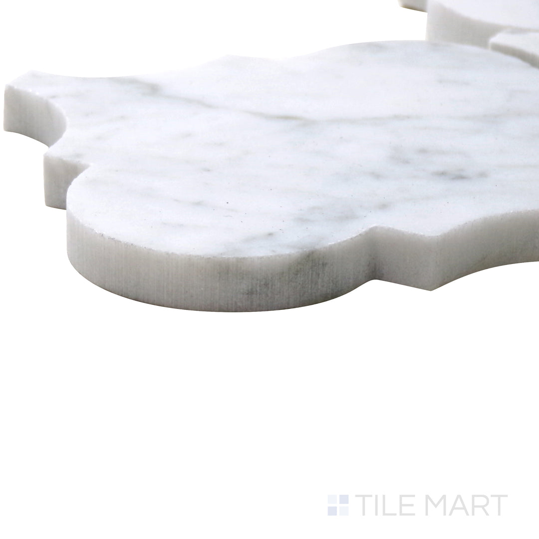 Angled close-up of Sto-Re Carrara Arabesque Polished Marble Mosaic, emphasizing its intricate arabesque pattern and classic white marble veining.