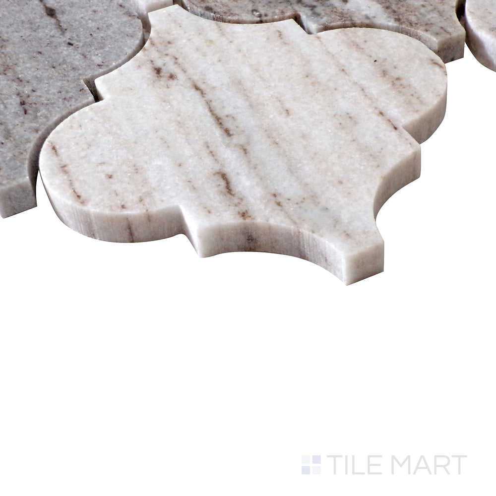 Diagonal shot of Sto-Re Ocean White Arabesque polished marble mosaic, highlighting its intricate curved design, natural veining, and glossy surface.  