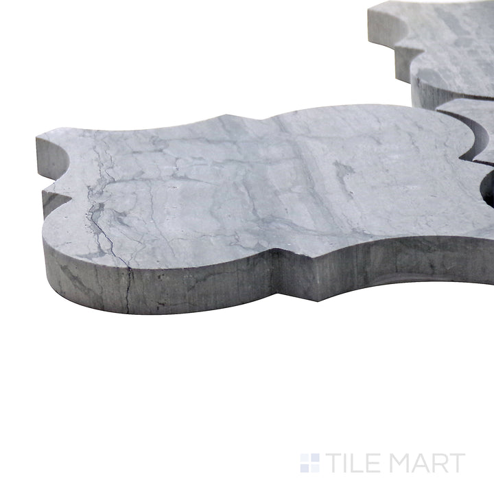 Side perspective of Sto-Re Wooden Blue Arabesque Polished Marble Mosaic, showcasing its bold blue-gray tones in a refined arabesque pattern.