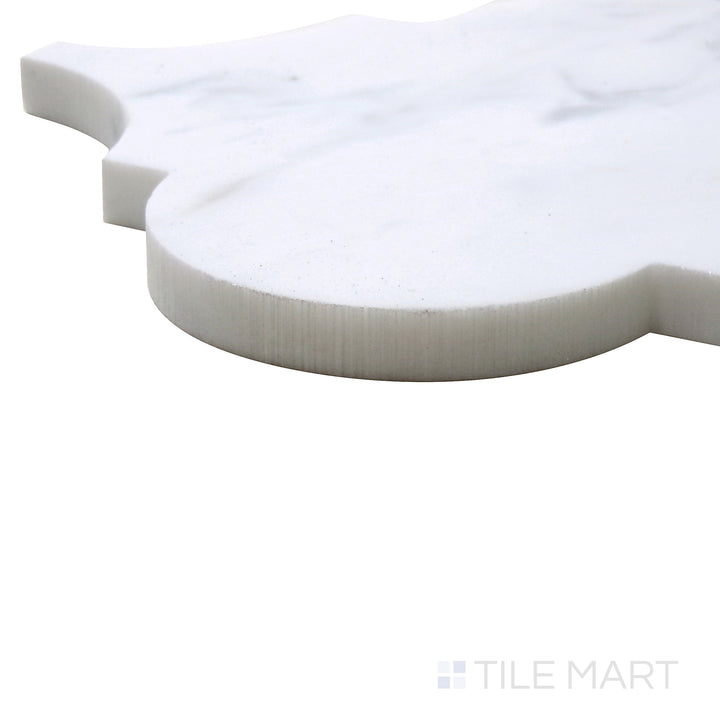Corner shot of Sto-Re Carrara Arabesque Polished Marble Mosaic, emphasizing its crisp white surface and interlocking arabesque design with polished detailing.