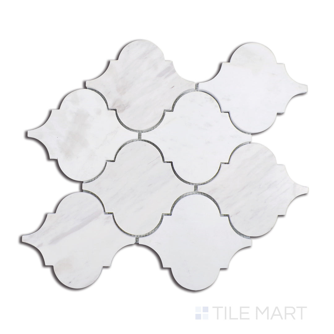 Close-up of Sto-Re Volakas Arabesque Polished Marble Mosaic, featuring a rich white marble with intricate grey veining in a stylish arabesque motif.