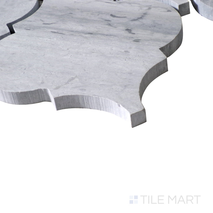 Slanted perspective of Sto-Re Wooden Blue Arabesque polished marble mosaic, highlighting its unique wood-like hues, flowing arabesque shapes, and glossy texture.  