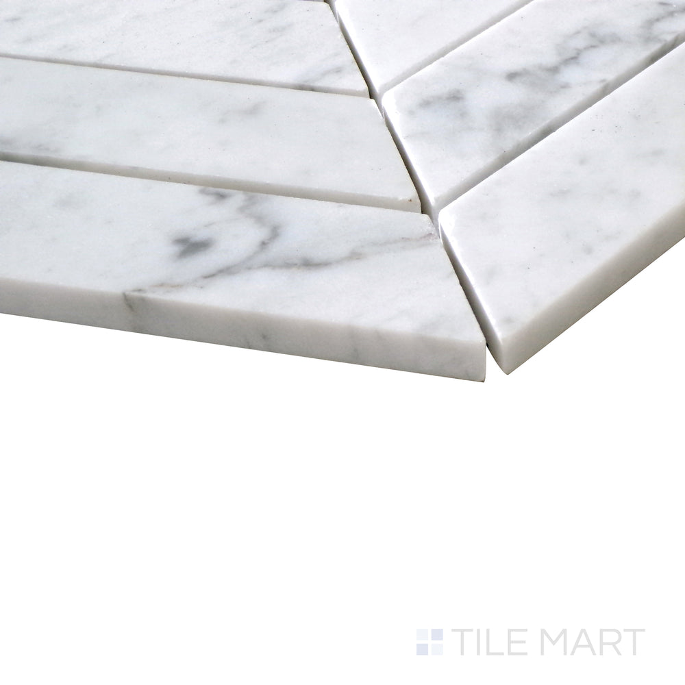 Diagonal view of Sto-Re Carrara Chevron polished marble mosaic, showcasing its elegant white marble with soft gray veining arranged in a striking chevron pattern.  