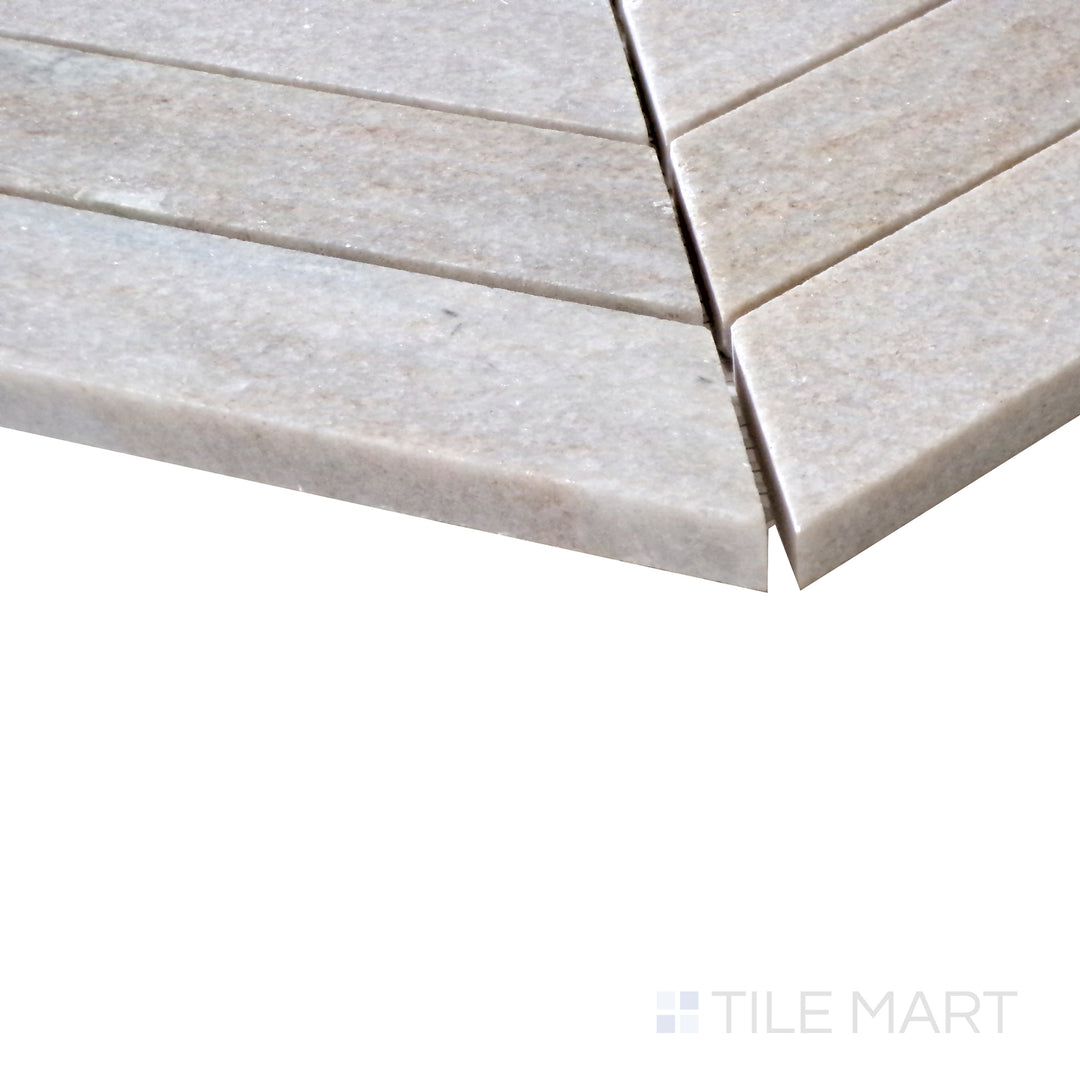 Slanted perspective of Sto-Re Ocean White Chevron polished marble mosaic, emphasizing its clean, bright tones, subtle veining, and modern geometric design.  