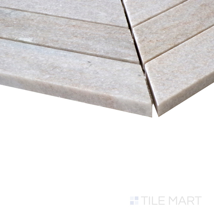 Slanted perspective of Sto-Re Ocean White Chevron polished marble mosaic, emphasizing its clean, bright tones, subtle veining, and modern geometric design.  