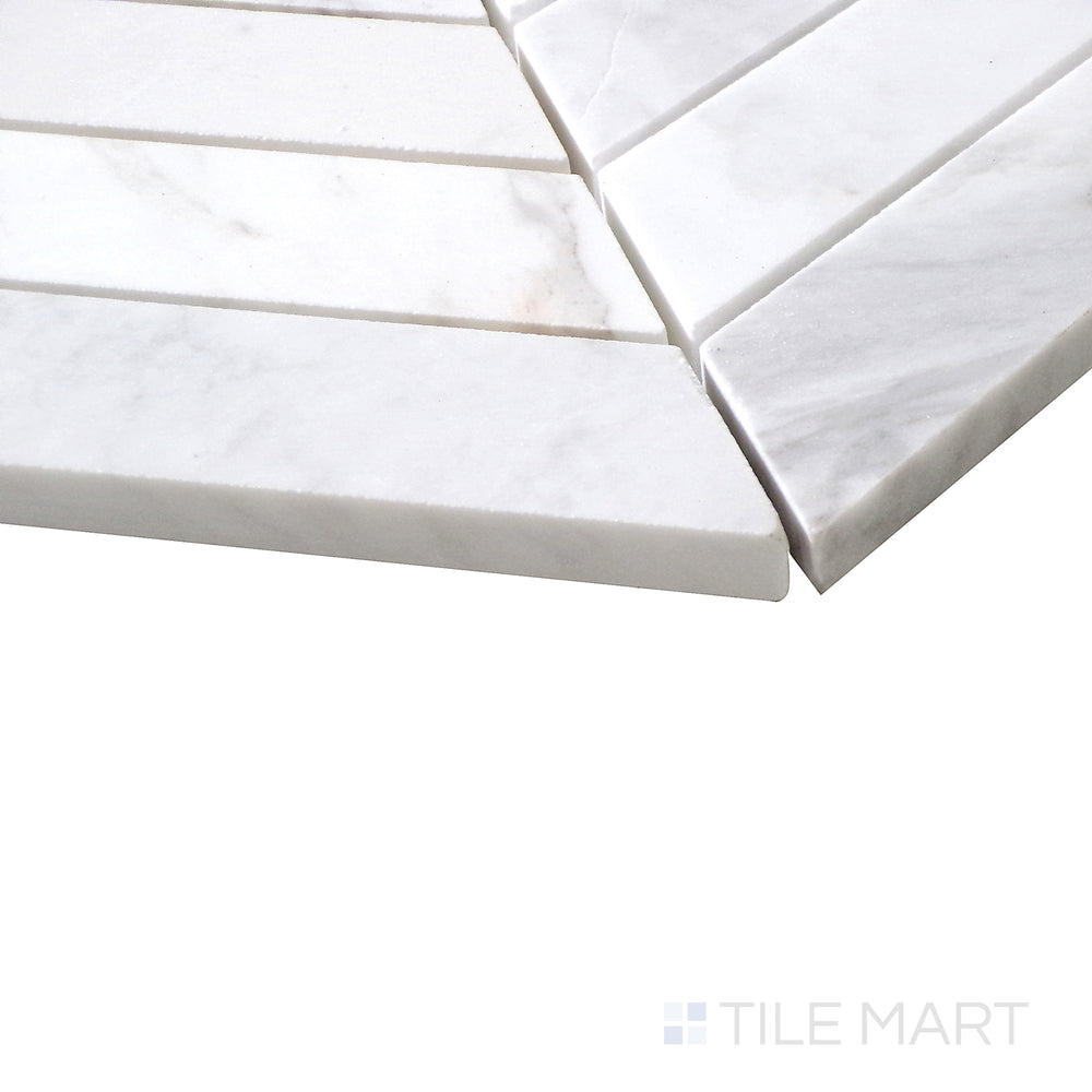 Angled view of Sto-Re Volakas Chevron polished marble mosaic, featuring a refined chevron layout with soft veining and a high-gloss finish.  