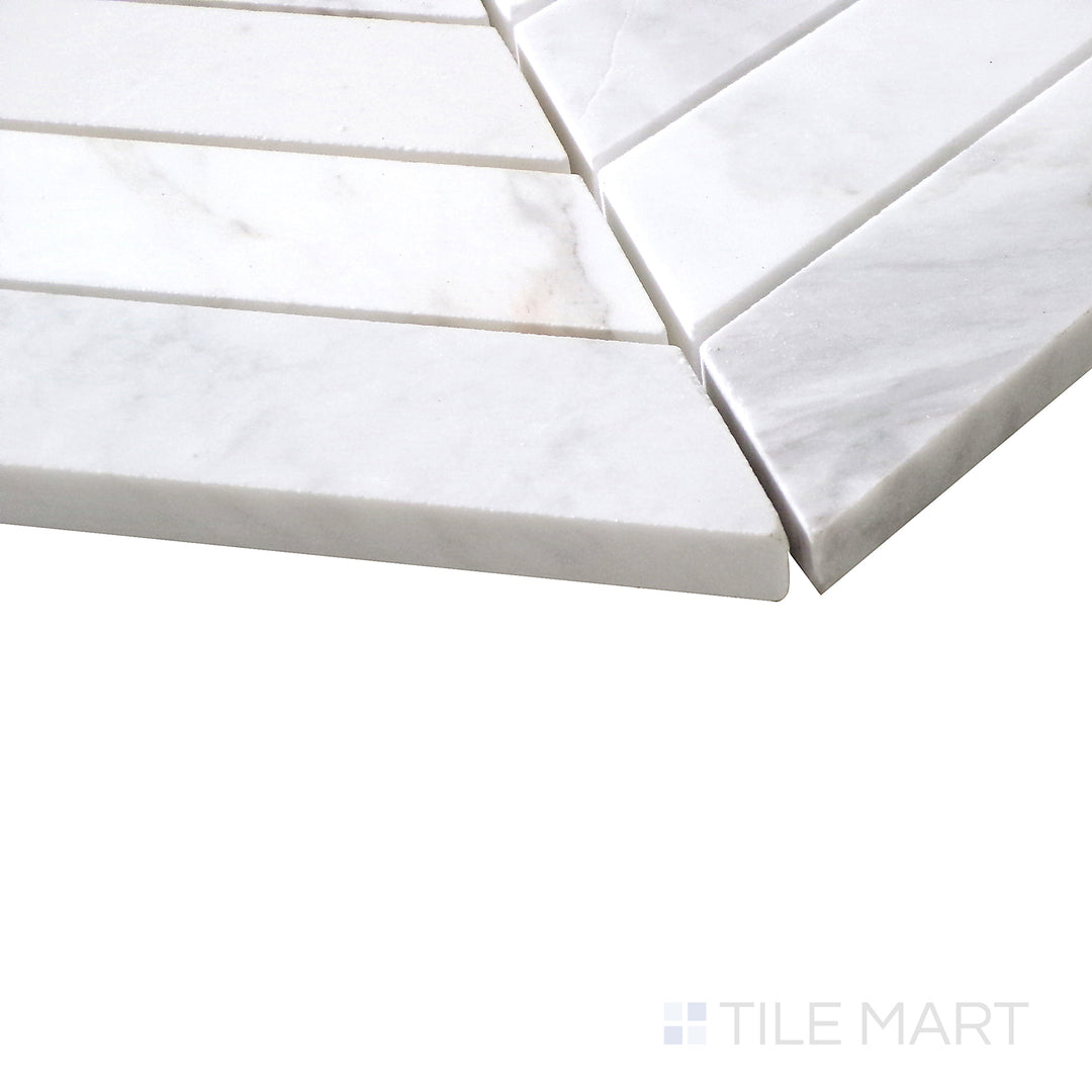Angled view of Sto-Re Volakas Chevron polished marble mosaic, featuring a refined chevron layout with soft veining and a high-gloss finish.  