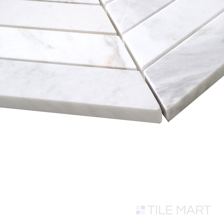 Angled view of Sto-Re Volakas Chevron polished marble mosaic, featuring a refined chevron layout with soft veining and a high-gloss finish.  
