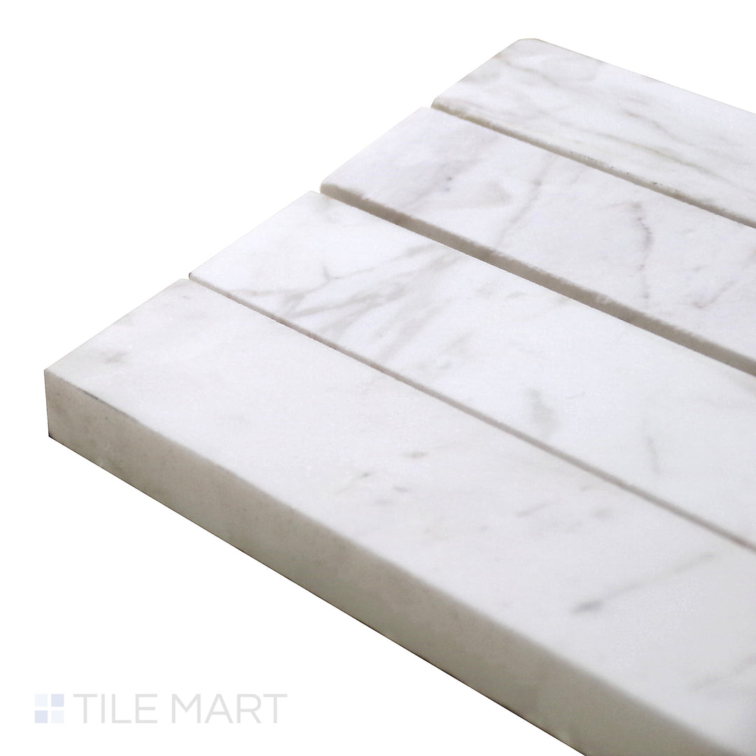 Corner-focused shot of Sto-Re Volakas Chevron Polished Marble Mosaic, capturing its soft gray veining and dynamic chevron design for a sophisticated look.