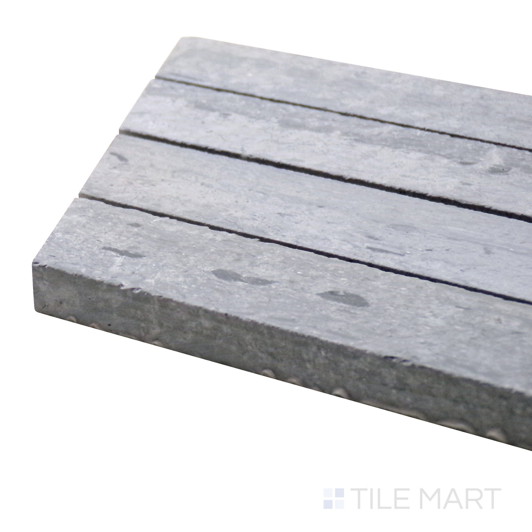 Angled close-up of Sto-Re Wooden Blue Chevron Polished Marble Mosaic, highlighting its unique blue-gray marble hues in a striking chevron arrangement.