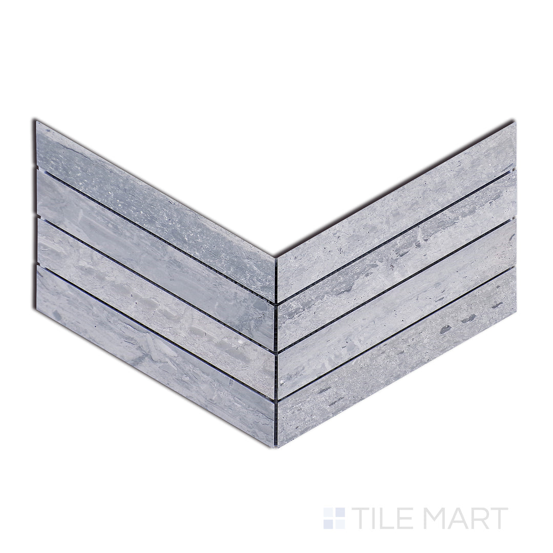 Flat lay of Sto-Re Wooden Blue Chevron Polished Marble Mosaic, showcasing a bold blue-grey marble in a polished chevron pattern for modern sophistication.