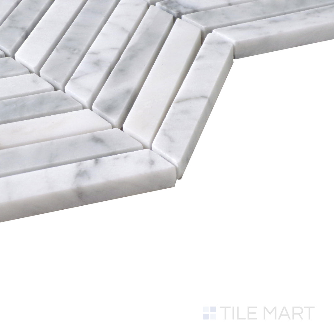 Slanted view of Sto-Re Carrara Chevron polished marble mosaic, highlighting its classic white marble base, delicate gray veining, and elegant chevron design.  
