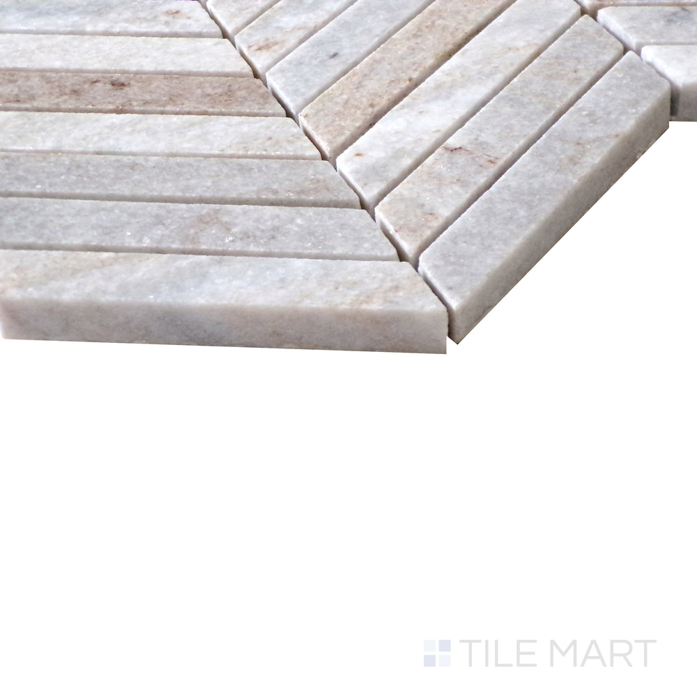 Diagonal angle of Sto-Re Ocean White Chevron polished marble mosaic, showcasing its bright white tones, natural veining, and contemporary chevron pattern.  