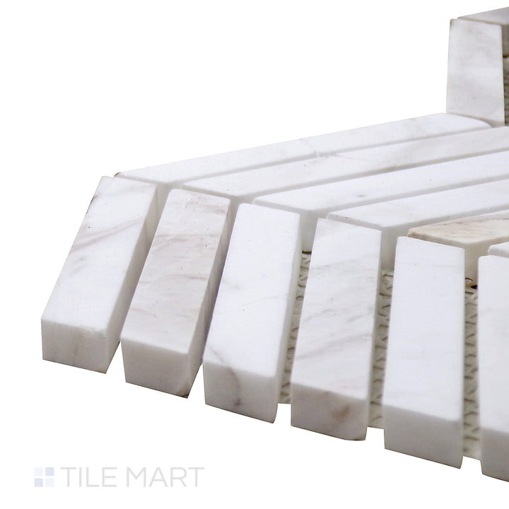 Corner shot of Sto-Re Volakas Chevron Polished Marble Mosaic, capturing its soft white and gray veining in a sleek, polished chevron pattern.