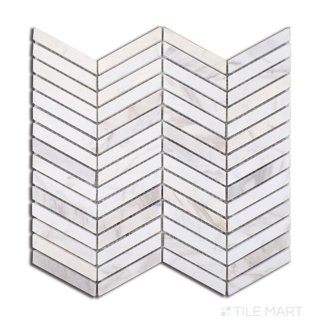 Top-down shot of Sto-Re Volakas Chevron Polished Marble Mosaic, highlighting soft white Volakas marble with subtle grey veining in a dynamic chevron layout.