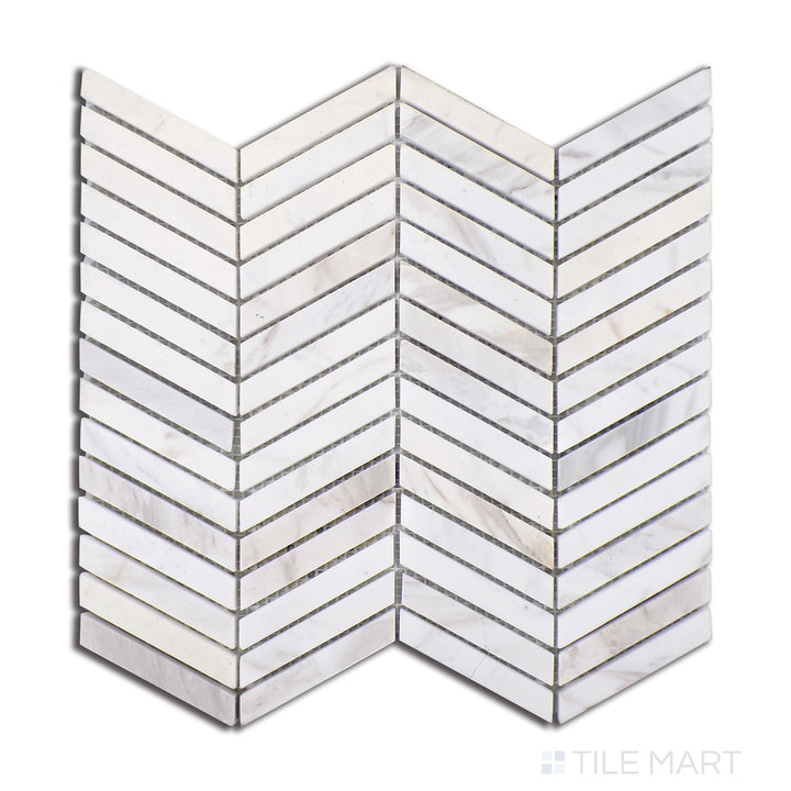 Top-down shot of Sto-Re Volakas Chevron Polished Marble Mosaic, highlighting soft white Volakas marble with subtle grey veining in a dynamic chevron layout.