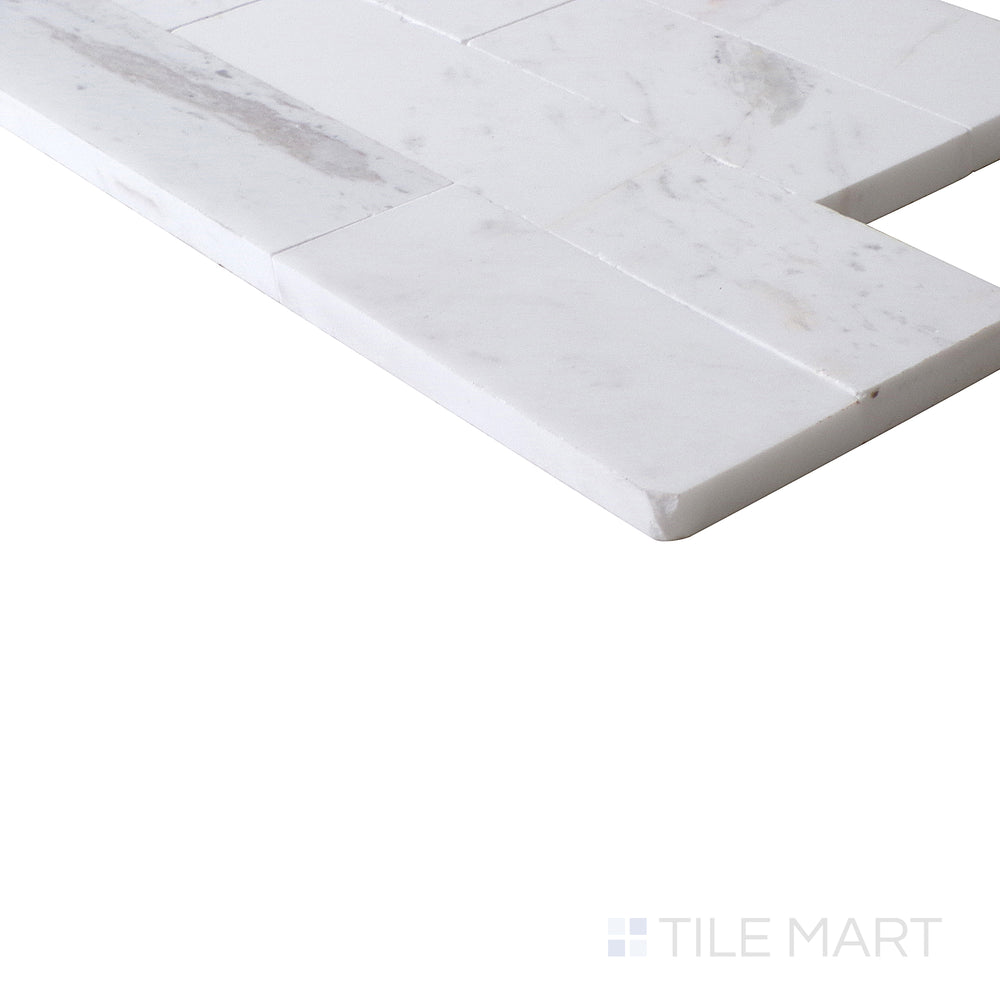 Slanted angle of Sto-Re Volakas Culture Pattern polished marble mosaic, showcasing its flowing veining, polished surface, and well-defined pattern structure.  