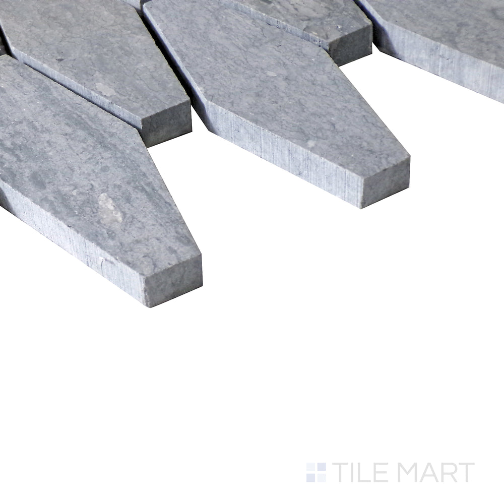 Diagonal view of Sto-Re Wooden Blue Elongated Hexagon polished marble mosaic, highlighting its soft blue-gray tones, elongated hexagon shapes, and polished texture.  
