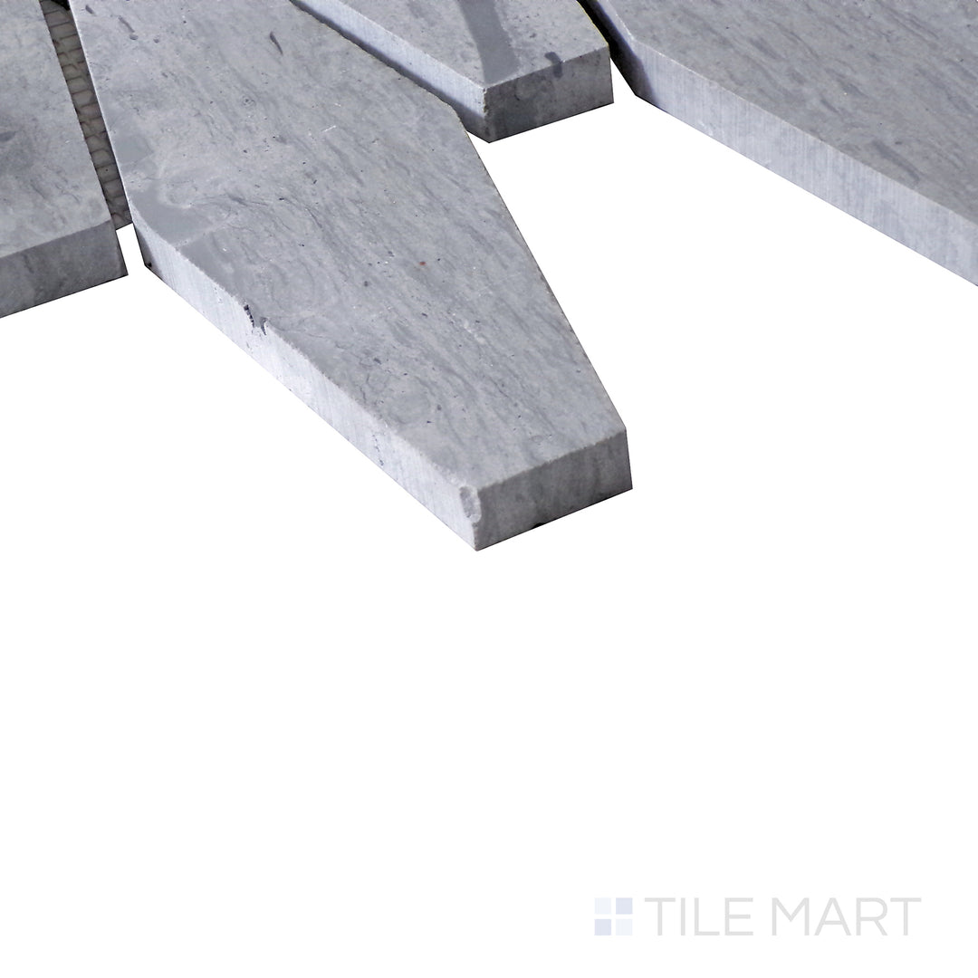 Diagonal shot of Sto-Re Wooden Blue Elongated Hexagon polished marble mosaic, capturing its unique wood-like hues, geometric hexagonal design, and smooth polished texture.  