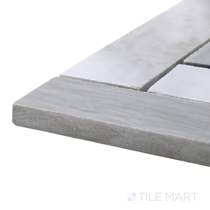 Corner shot of Sto-Re Bardiglio Herringbone Polished Marble Mosaic, highlighting its deep gray tones arranged in a timeless herringbone pattern.