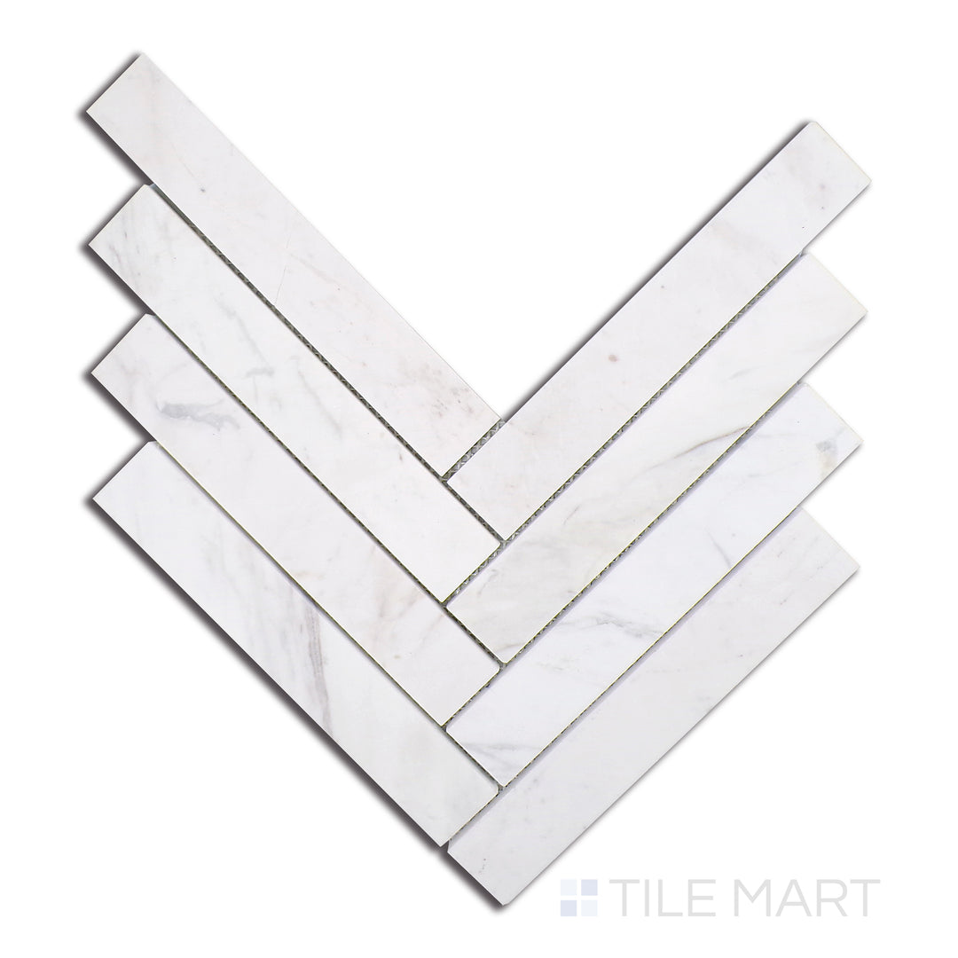 Flat lay of Sto-Re Volakas Herringbone Polished Marble Mosaic, showcasing elegant white and grey Volakas marble with a polished sheen in a classic herringbone pattern.