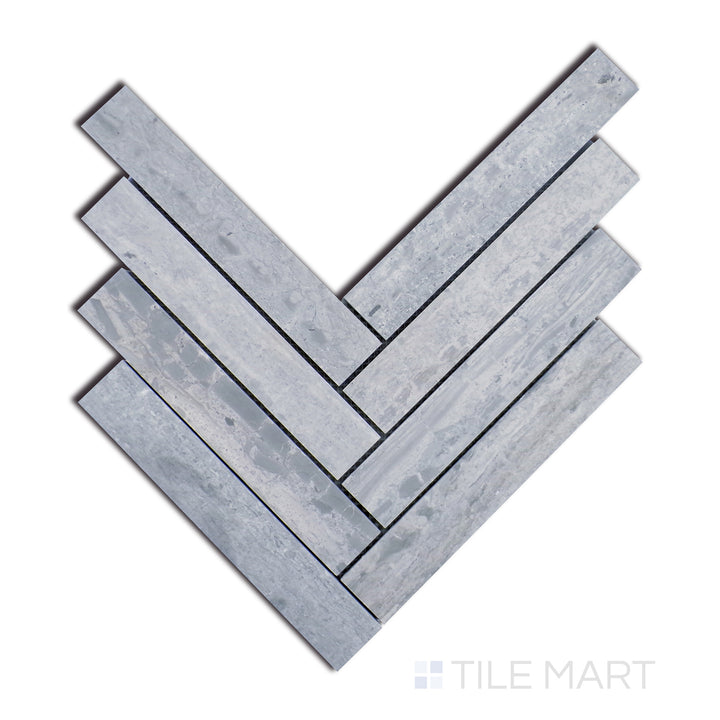 Top-down shot of Sto-Re Wooden Blue Herringbone Polished Marble Mosaic, highlighting bold blue-grey marble with a sleek finish in a sophisticated herringbone design.