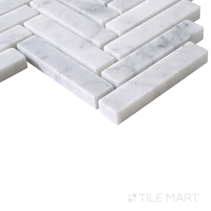 Flat lay of Sto-Re Carrara Herringbone Polished Marble Mosaic, featuring the timeless beauty of white Carrara marble with soft veining, polished to perfection in a herringbone layout.