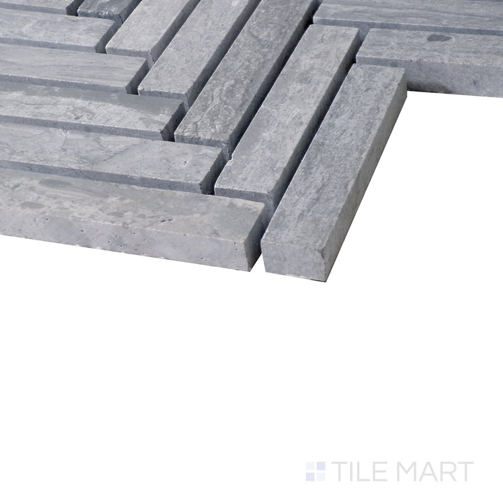 Diagonal view of Sto-Re Wooden Blue Herringbone polished marble mosaic, highlighting its soft blue-gray tones, elegant herringbone layout, and smooth polished texture.  
