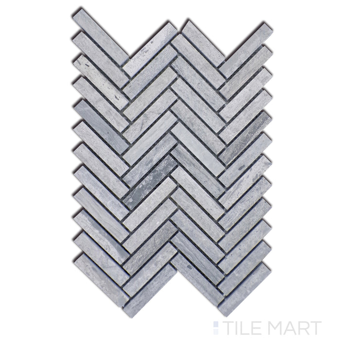 Close-up of Sto-Re Wooden Blue Herringbone Polished Marble Mosaic, highlighting the striking blue-grey hues in an intricate herringbone pattern with a glossy surface.